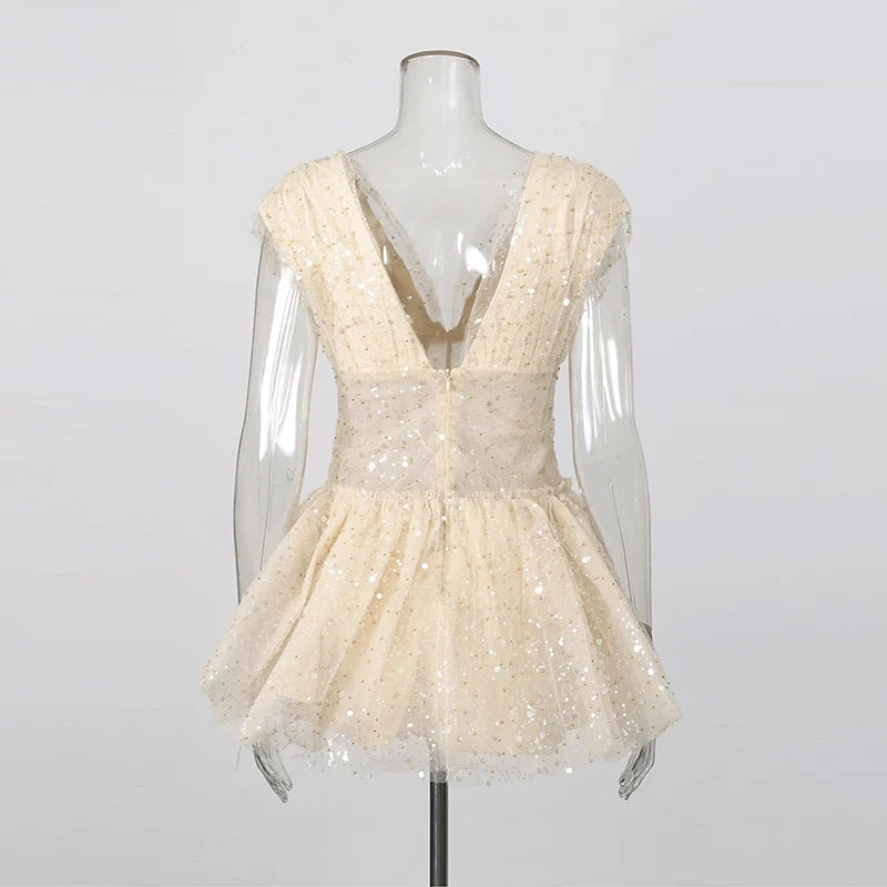 The Lumière Sequin Ruffle Mini Dress from the Celebration Edit at Lavishly Me